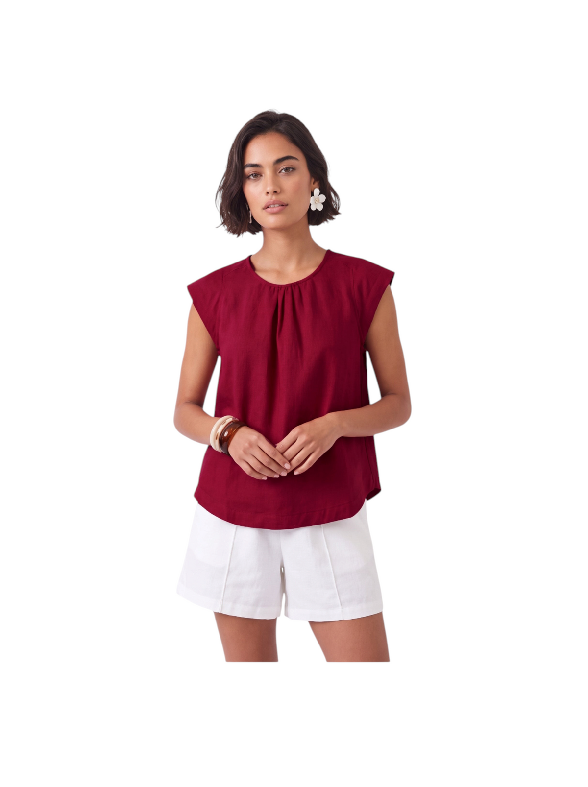 Model wearing a Metro Singapore Departmental Store - Celebrating 69 Years in SG K/Woods Ember Top in deep red with cap sleeves and center-neck gathers, paired with white shorts.