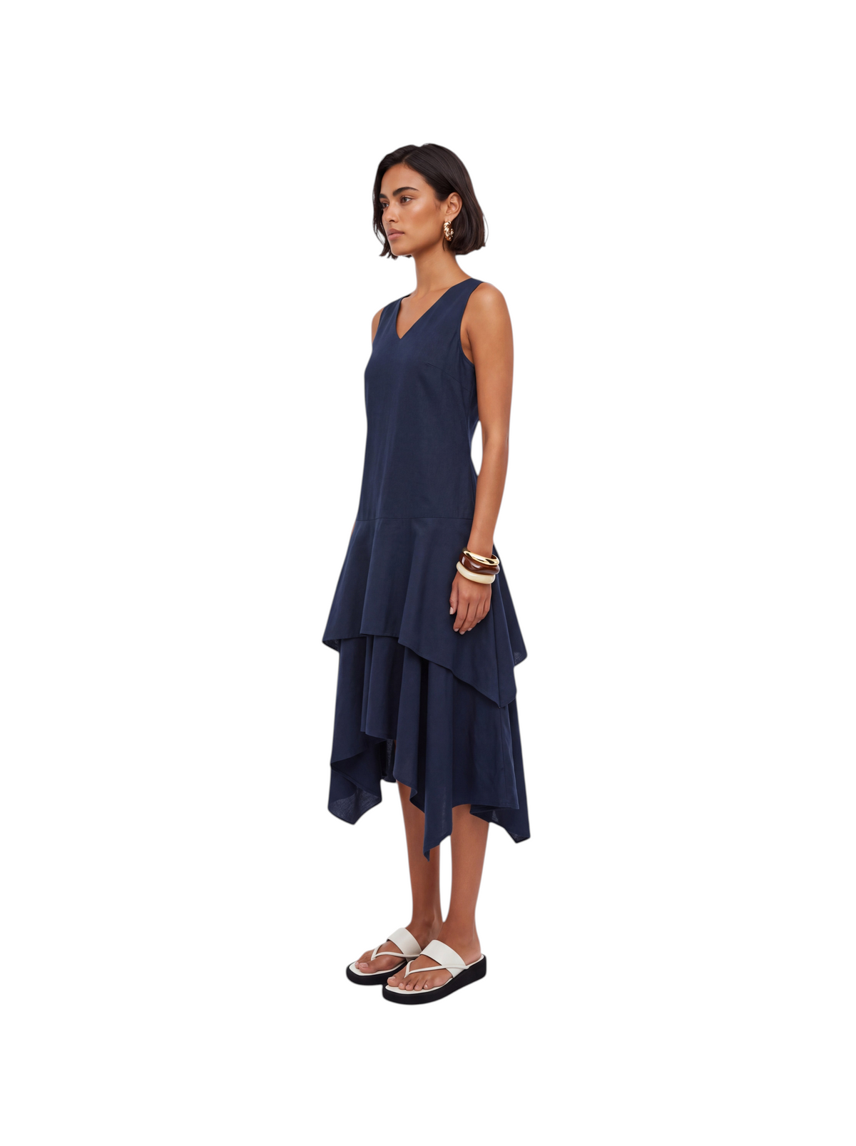 Model wearing a navy blue K/Woods Solstice sleeveless dress with a handkerchief hem from Metro Singapore Departmental Store - Celebrating 69 Years in SG