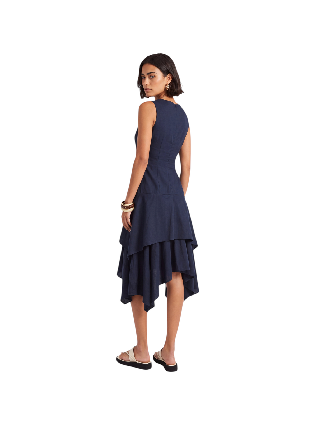 Model wearing a navy K/Woods Solstice sleeveless dress with a tiered handkerchief hem from Metro Singapore Departmental Store - Celebrating 69 Years in SG